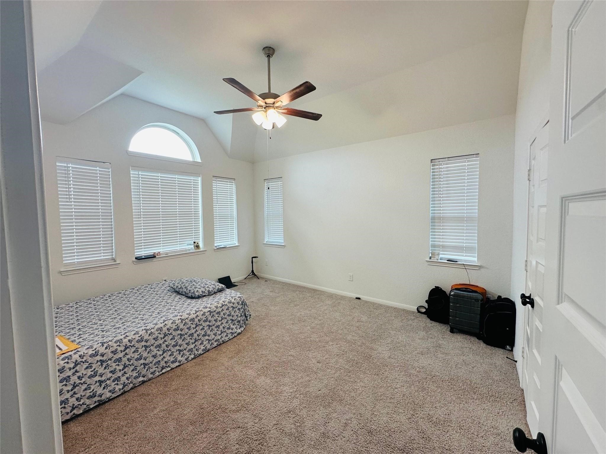 2419 Humble Way Rosenberg, TX 77471 - Photo 6 of 38 a bedroom with a bed and window