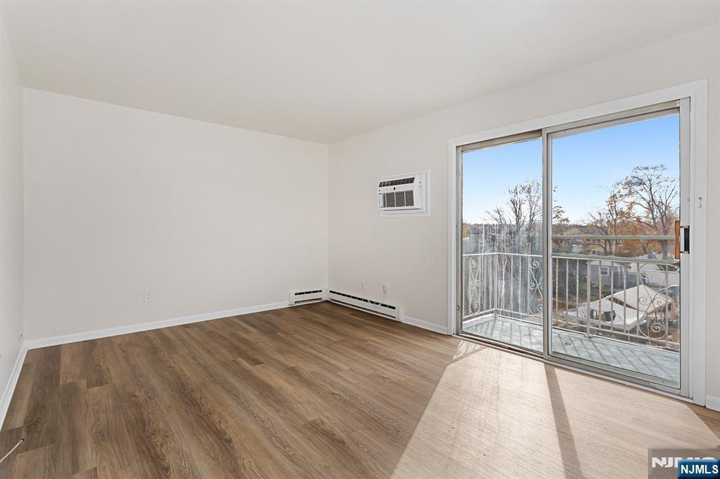 145 Arnot Street, Unit 4B Lodi, NJ 07644 - Photo 14 of 21 a view of a room with wooden floor