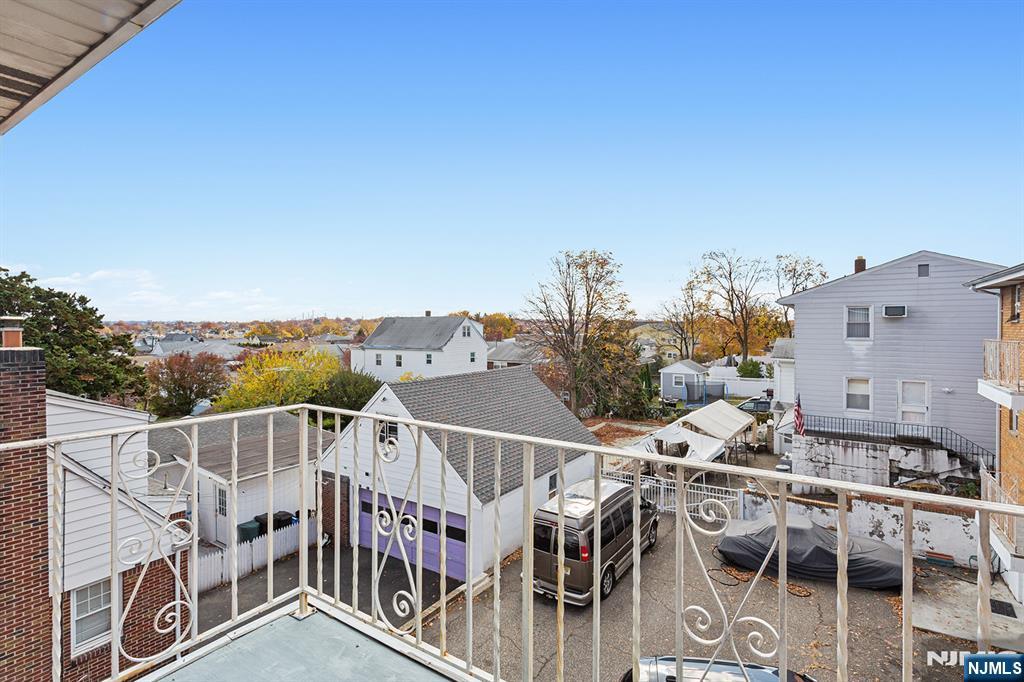 145 Arnot Street, Unit 4B Lodi, NJ 07644 - Photo 19 of 21 an aerial view of a house with wooden fence