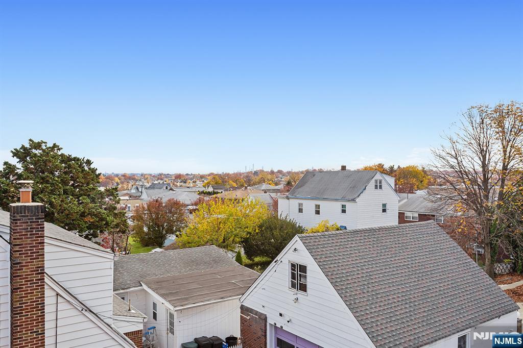 145 Arnot Street, Unit 4B Lodi, NJ 07644 - Photo 21 of 21 a view of a terrace with a garden