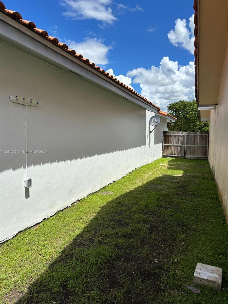 5656 Southwest 149th Place Miami, FL 33193 - Photo 17 of 28 a backyard with a garden