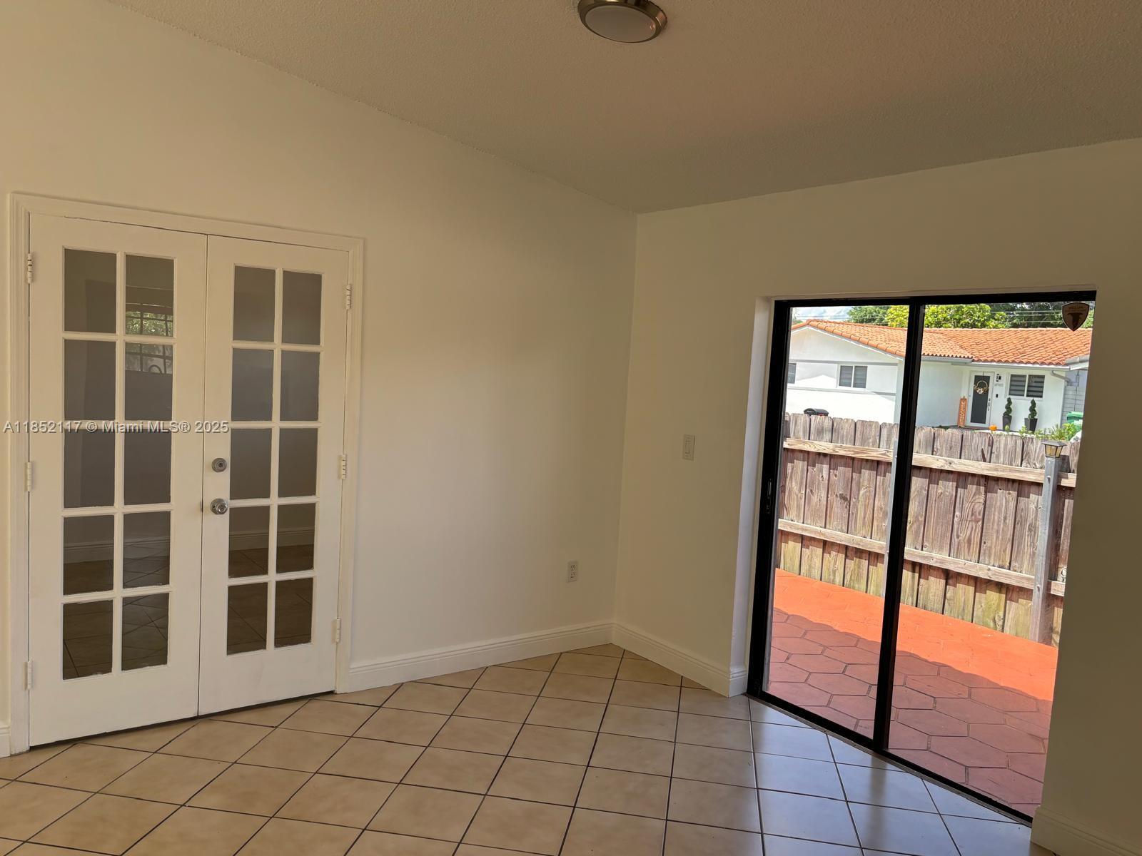 5656 Southwest 149th Place Miami, FL 33193 - Photo 5 of 28 a view of an empty room with a window