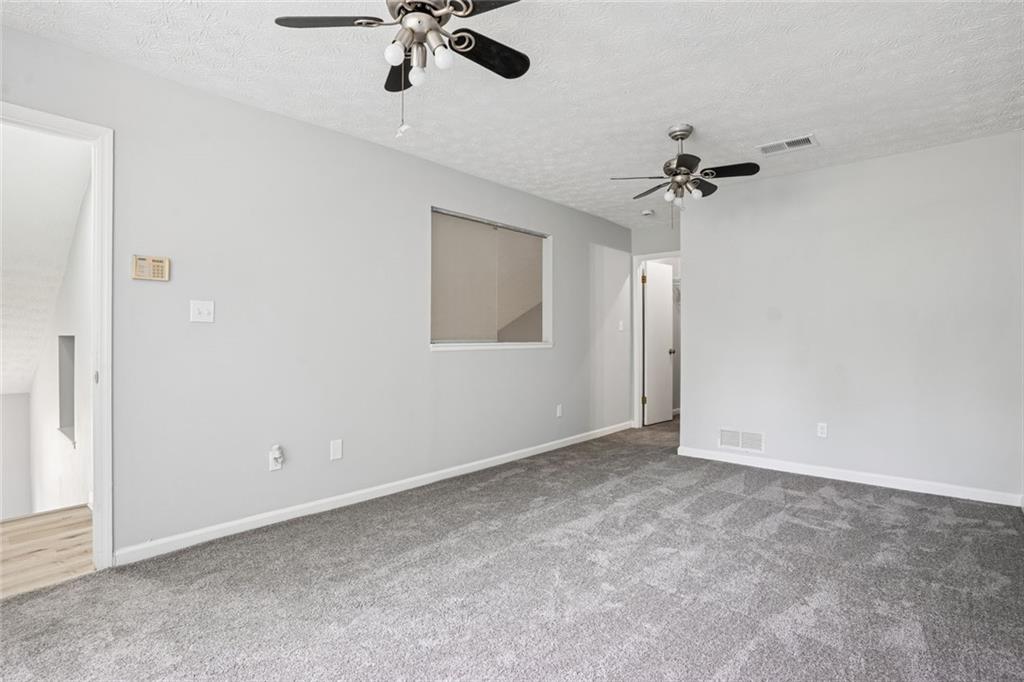 6430 Oakleaf Way Morrow, GA 30260 - Photo 17 of 23 a view of room with a ceiling fan
