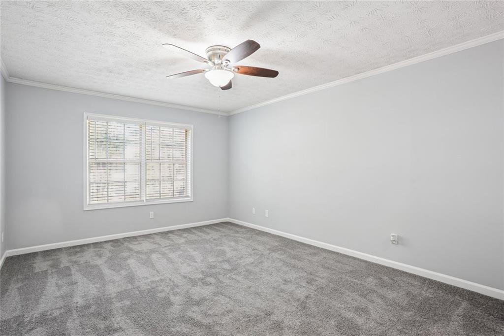 6430 Oakleaf Way Morrow, GA 30260 - Photo 18 of 23 an empty room with windows and fan
