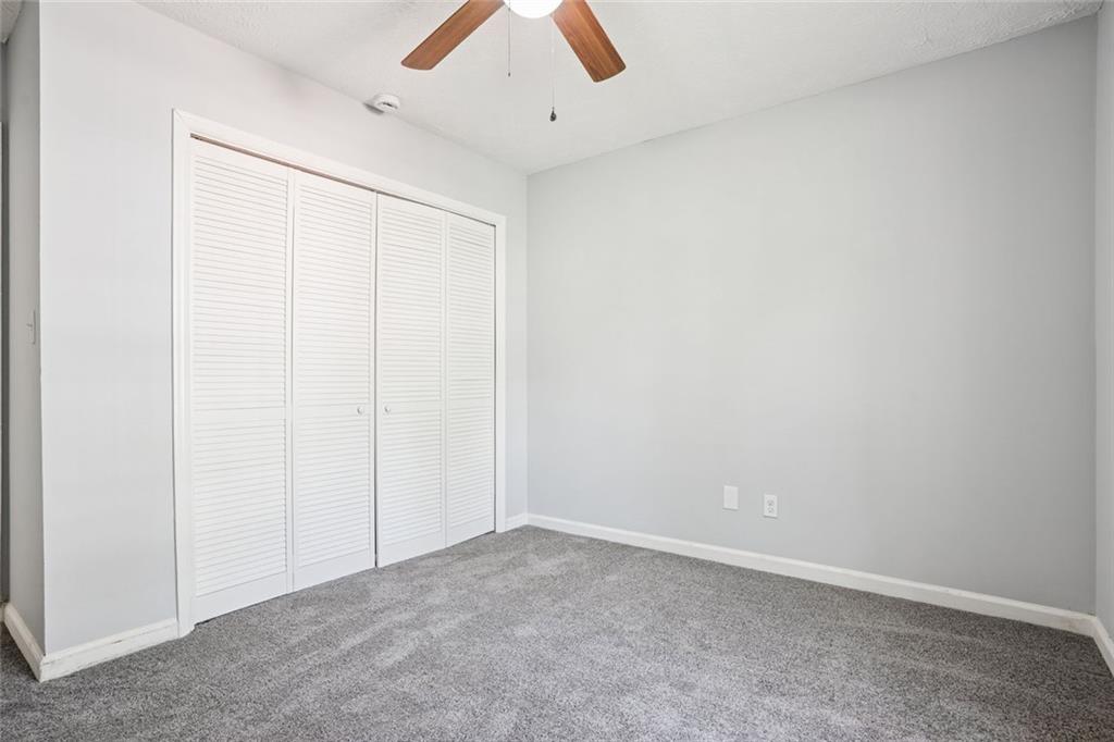 6430 Oakleaf Way Morrow, GA 30260 - Photo 20 of 23 an empty room with ceiling fan and window