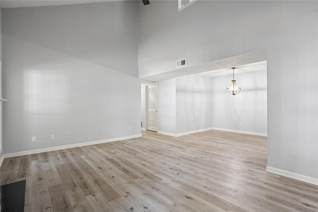 6430 Oakleaf Way Morrow, GA 30260 - Photo 22 of 23 a view of an empty room with wooden floor