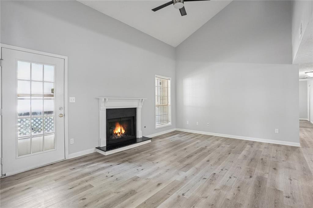 6430 Oakleaf Way Morrow, GA 30260 - Photo 10 of 23 an empty room with windows and fireplace