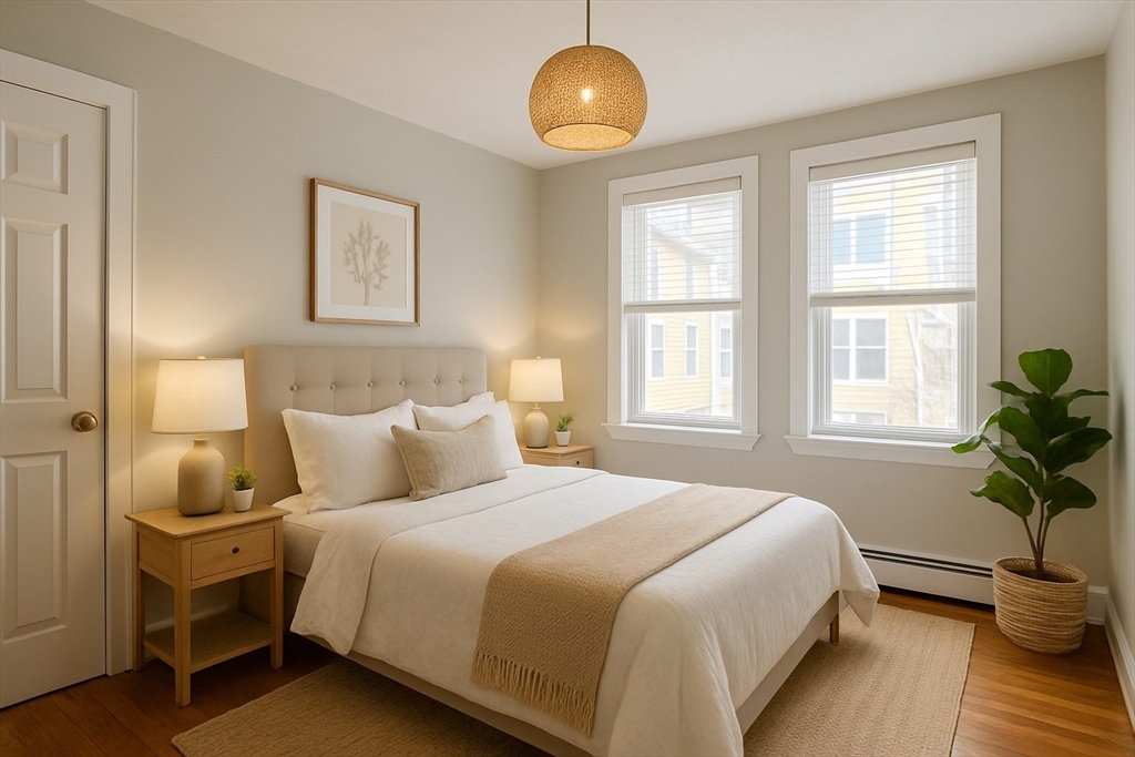 a bedroom with bed and a window