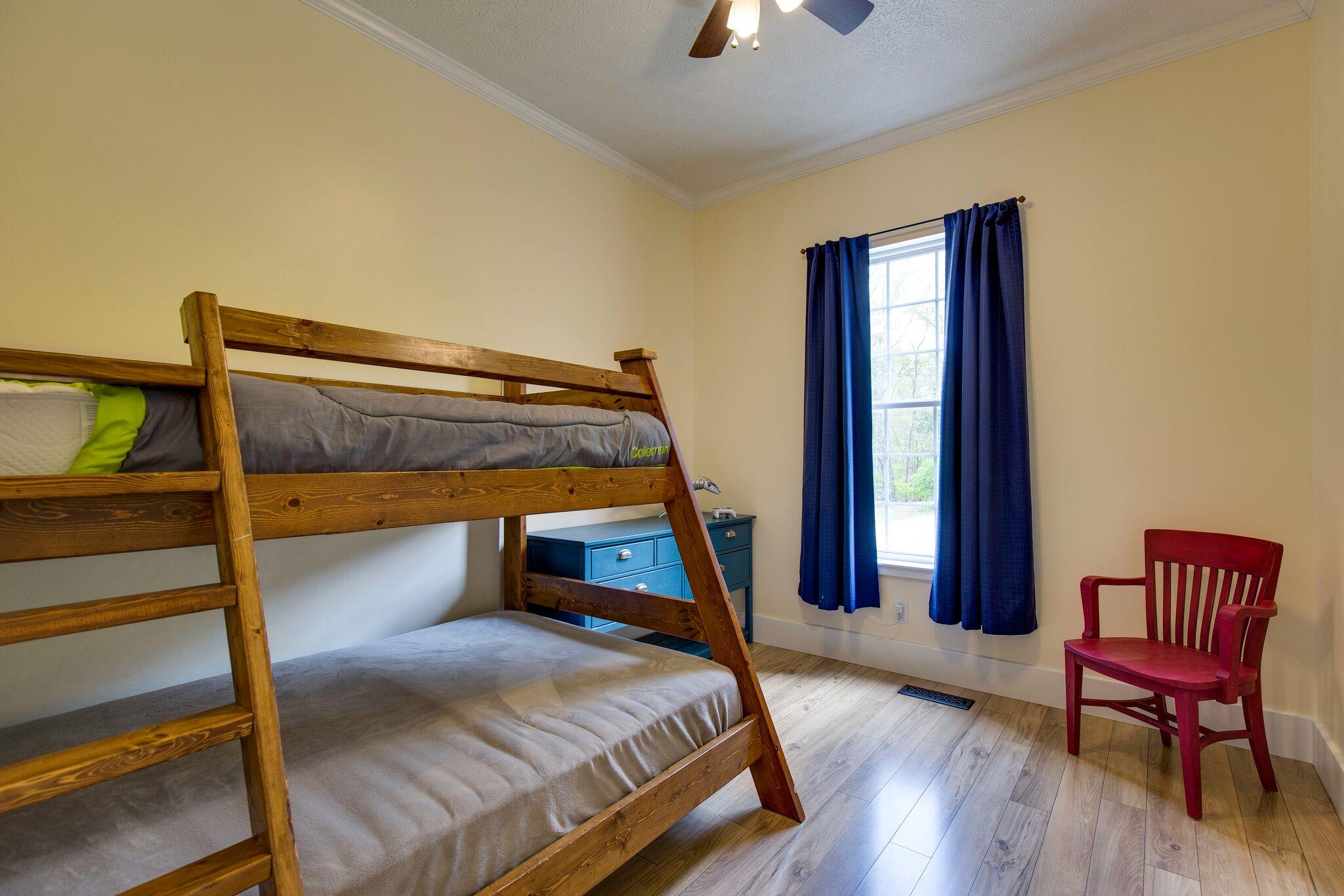 685 Bates Road Lebanon, TN 37087 - Photo 22 of 30 a bedroom with a bed and a chair
