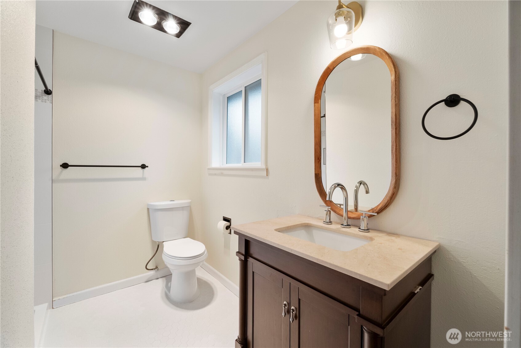 832 Torrey Street Southeast Olympia, WA 98513 - Photo 15 of 27 a bathroom with a toilet sink and mirror