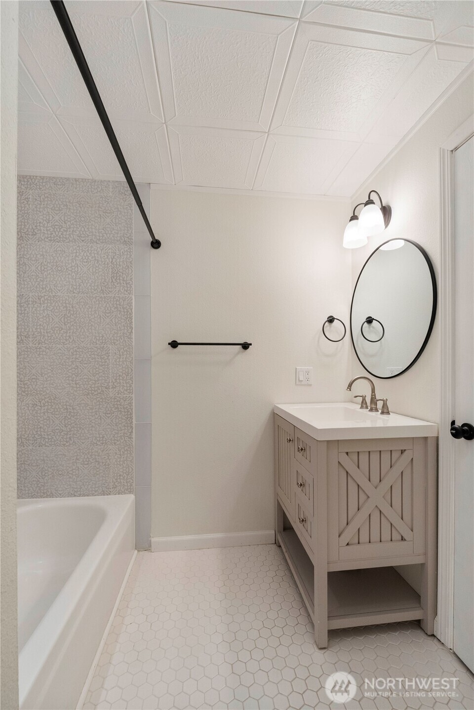 832 Torrey Street Southeast Olympia, WA 98513 - Photo 20 of 27 a bathroom with a tub a sink and a mirror