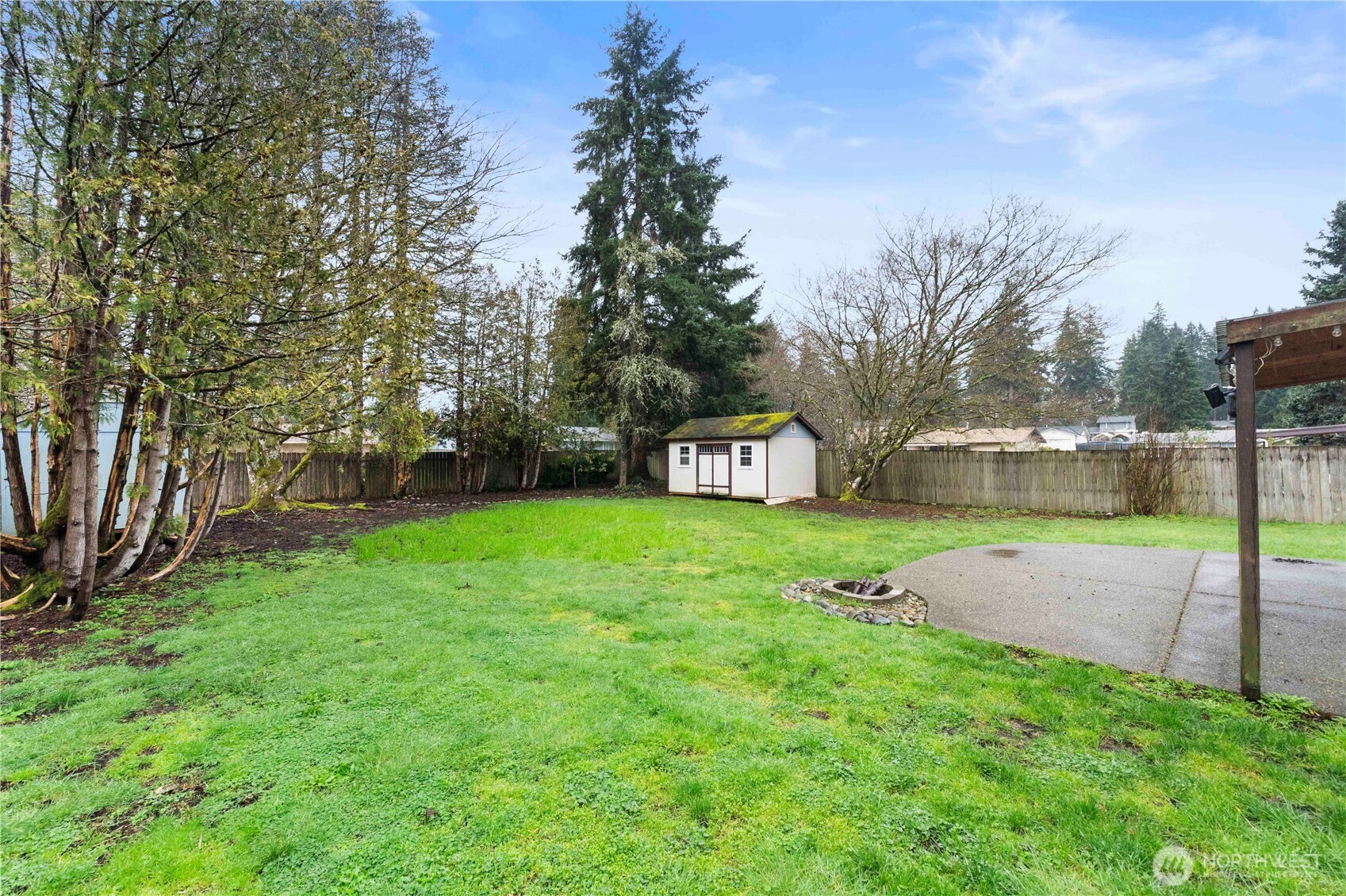 832 Torrey Street Southeast Olympia, WA 98513 - Photo 25 of 27 a view of a garden with a building in the background