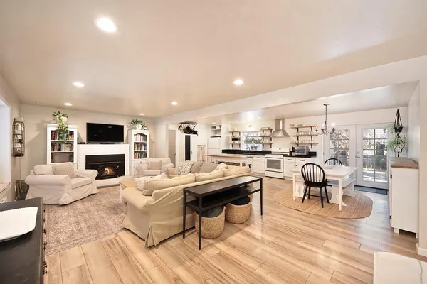 a living room with fireplace furniture and a flat screen tv