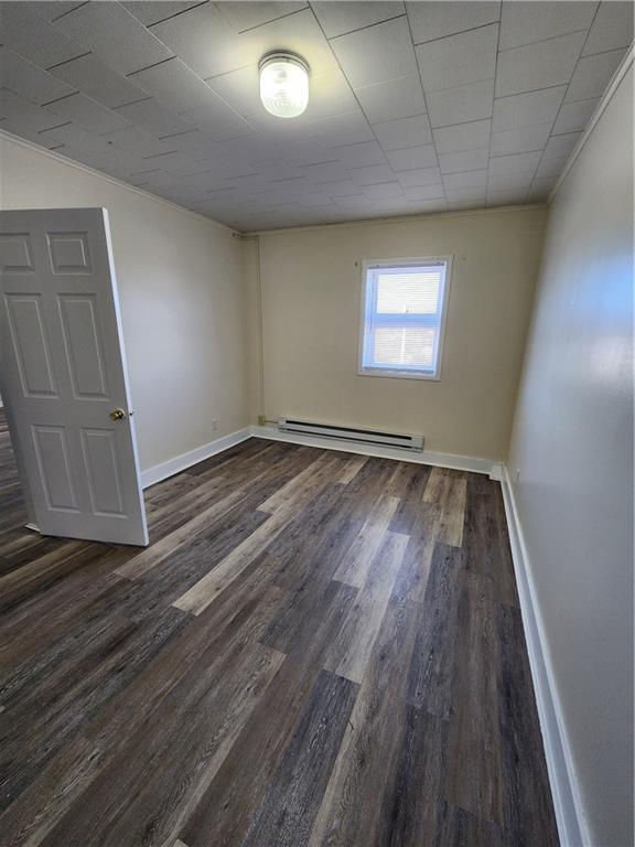 120 East 1st Avenue, Unit 201 Derry, PA 15627 - Photo 4 of 5 a view of an empty room with wooden floor and a window