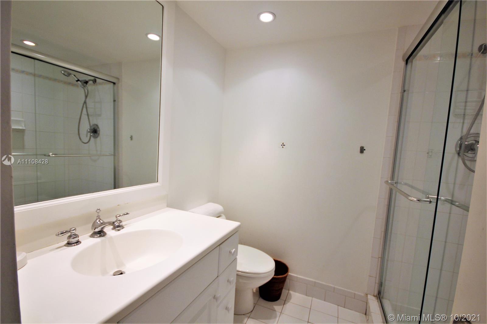 5161 Collins Avenue, Unit 711 Miami Beach, FL 33140 - Photo 16 of 67 a bathroom with a sink and a toilet