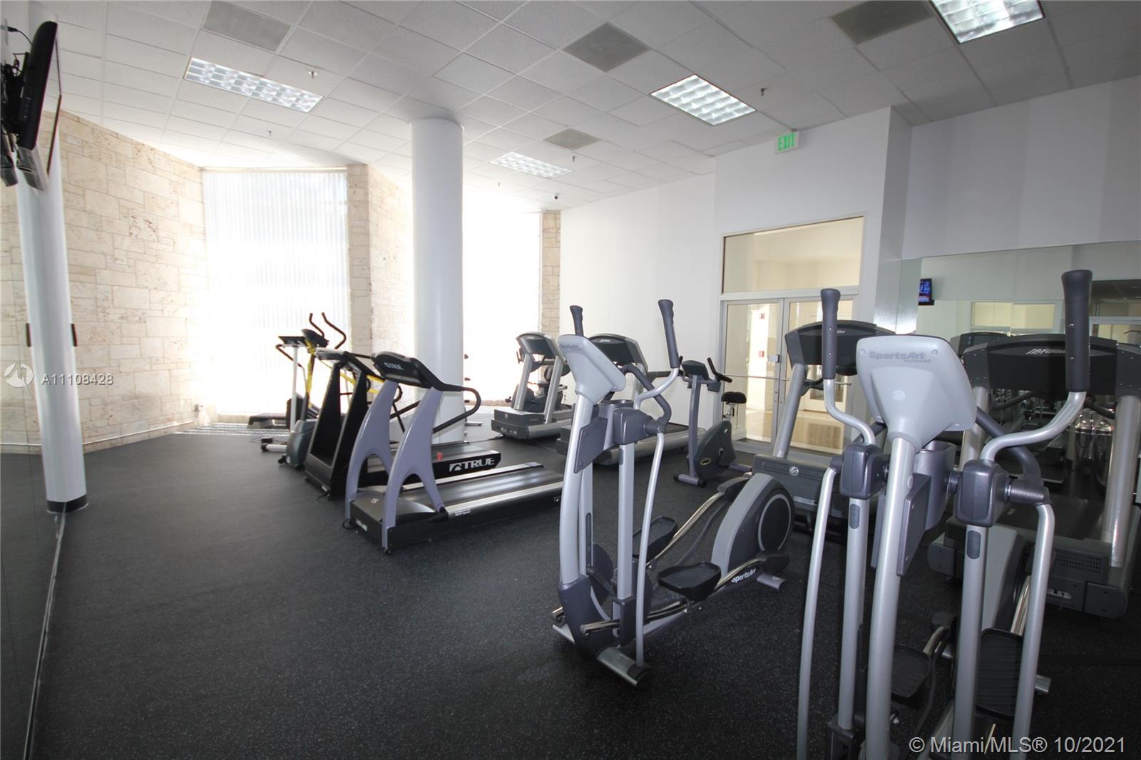 5161 Collins Avenue, Unit 711 Miami Beach, FL 33140 - Photo 63 of 67 a view of a room with gym equipment