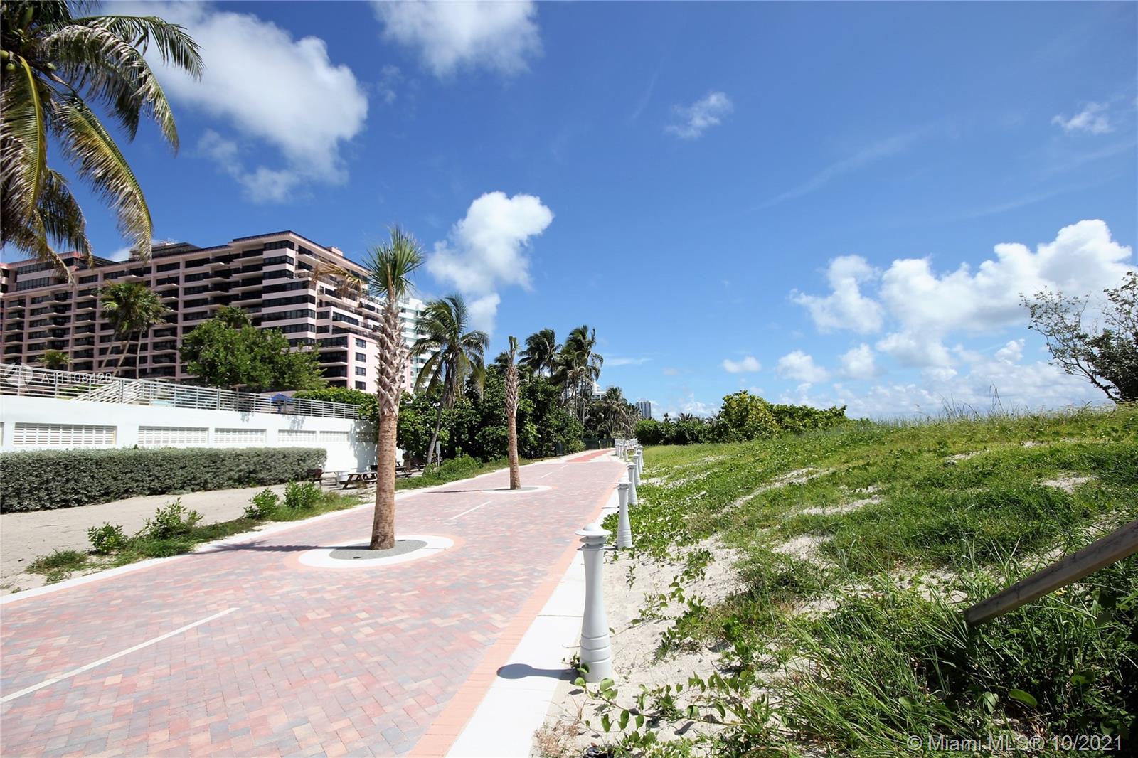5161 Collins Avenue, Unit 711 Miami Beach, FL 33140 - Photo 67 of 67 a view of a pathway with a wrought fence