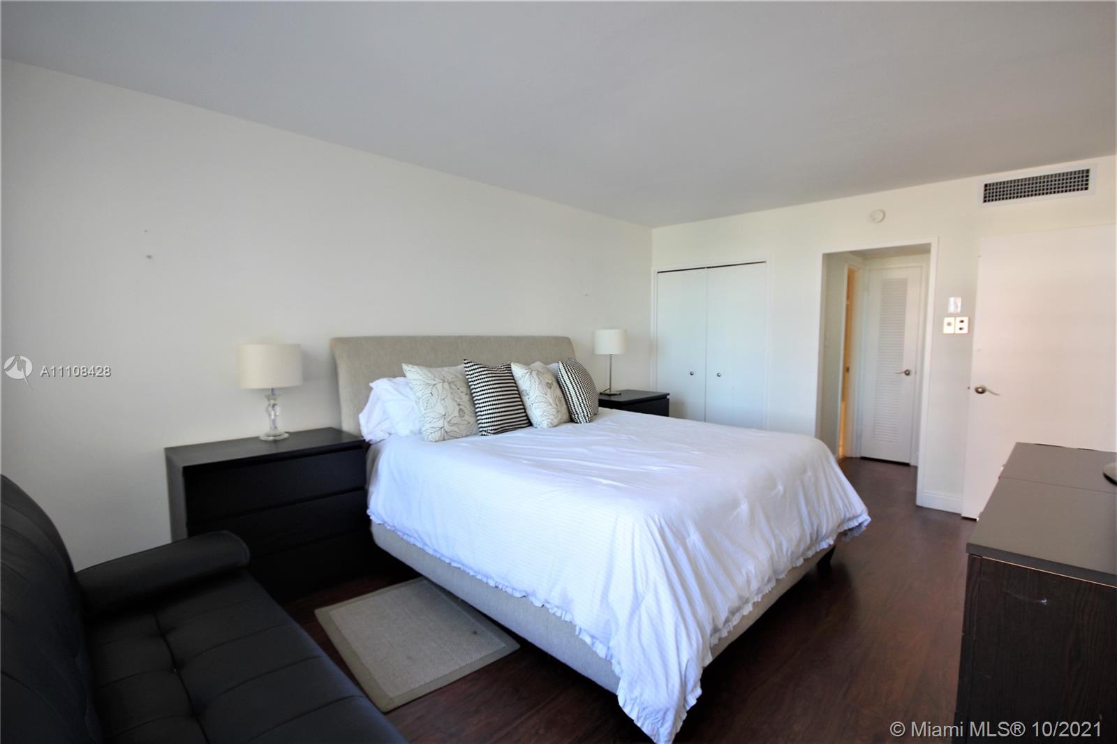 5161 Collins Avenue, Unit 711 Miami Beach, FL 33140 - Photo 9 of 67 a bedroom with a bed and window