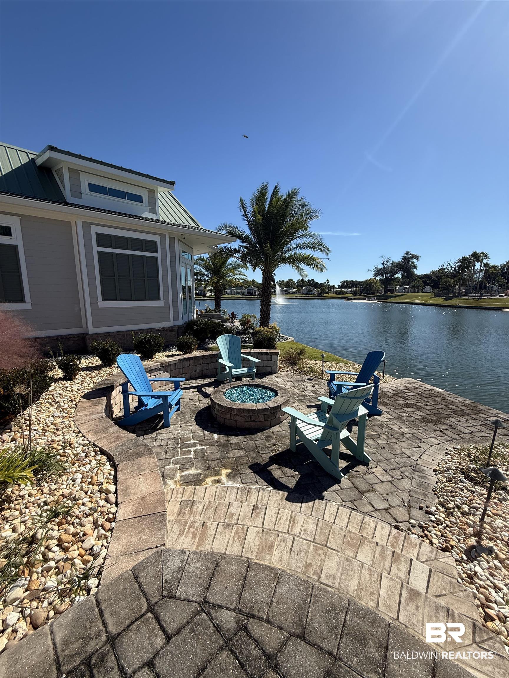28152 Migratory Way Elberta, AL 36530 - Photo 17 of 54 View of patio featuring an outdoor fire pit and a water view