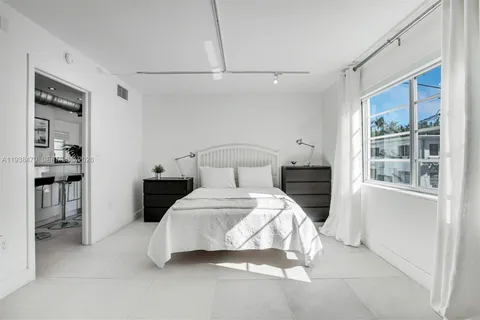 a bedroom with a bed and a table