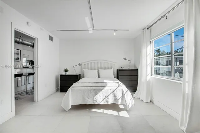 a bedroom with a bed and a table