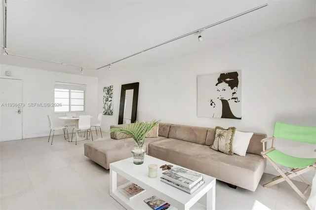 a living room with furniture and a table