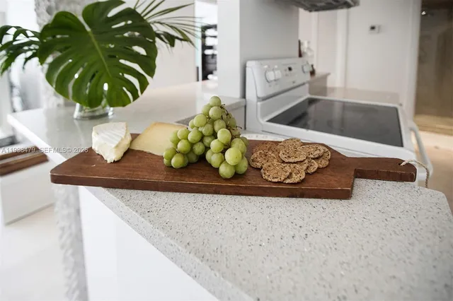 a front view of a building with trees