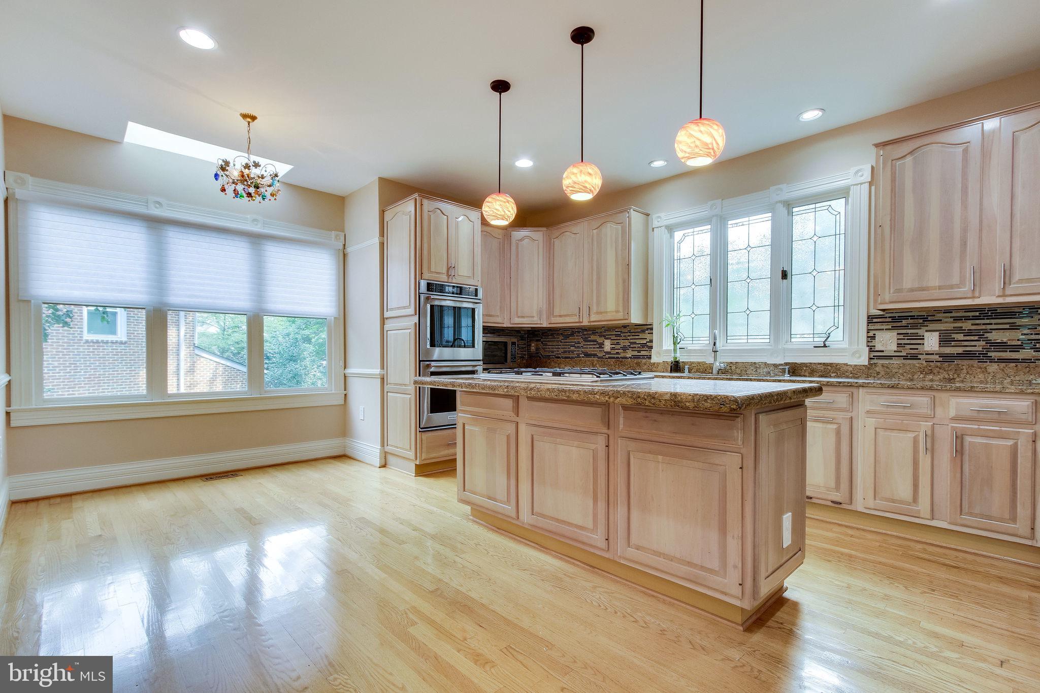 6570 Old Chesterbrook Road McLean, VA 22101 - Photo 15 of 69 Open concept eat-in kitchen w/ barstool seating