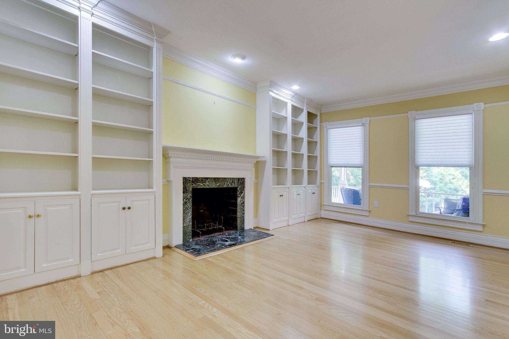 6570 Old Chesterbrook Road McLean, VA 22101 - Photo 9 of 69 Wood burning fireplace and custombuilt-ins