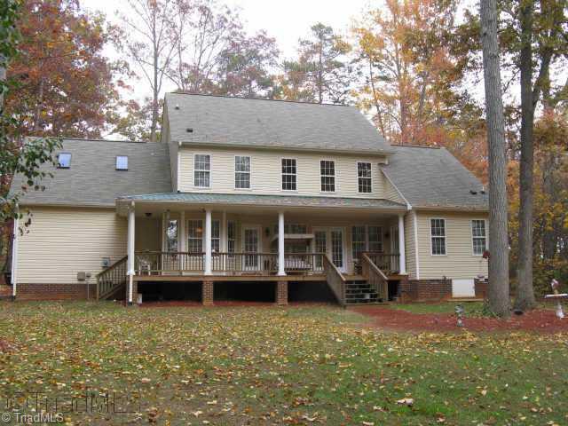 7321 Strawberry Road Summerfield, NC 27358 - Photo 8 of 9 Other. Rockin chair back porch looks out over huge backyard.