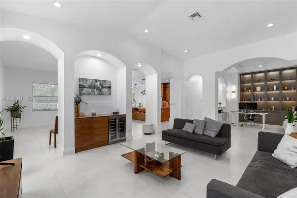 a white toilet sitting next to a bathroom sink