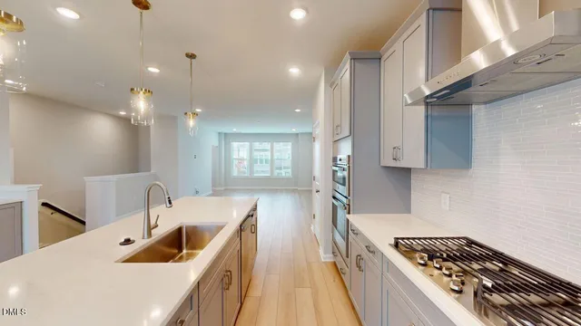 a bathroom with a double vanity sink a large mirror and a shower
