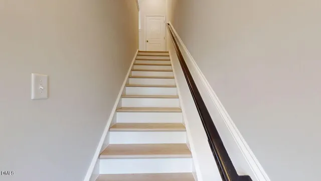 a large kitchen with kitchen island a large counter space a sink appliances and a large window