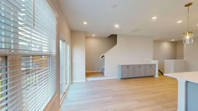 a kitchen with stainless steel appliances a refrigerator and a stove top oven