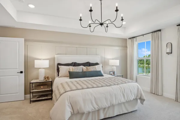 a bedroom with bed and a window
