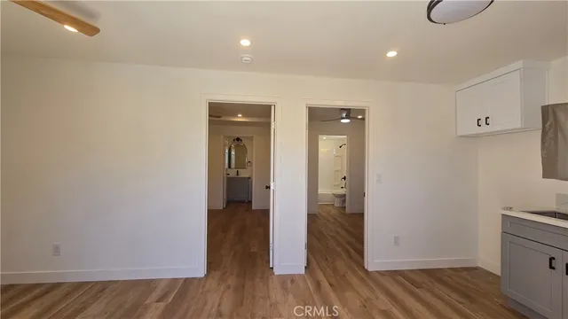 a kitchen with stainless steel appliances granite countertop a sink stove and microwave