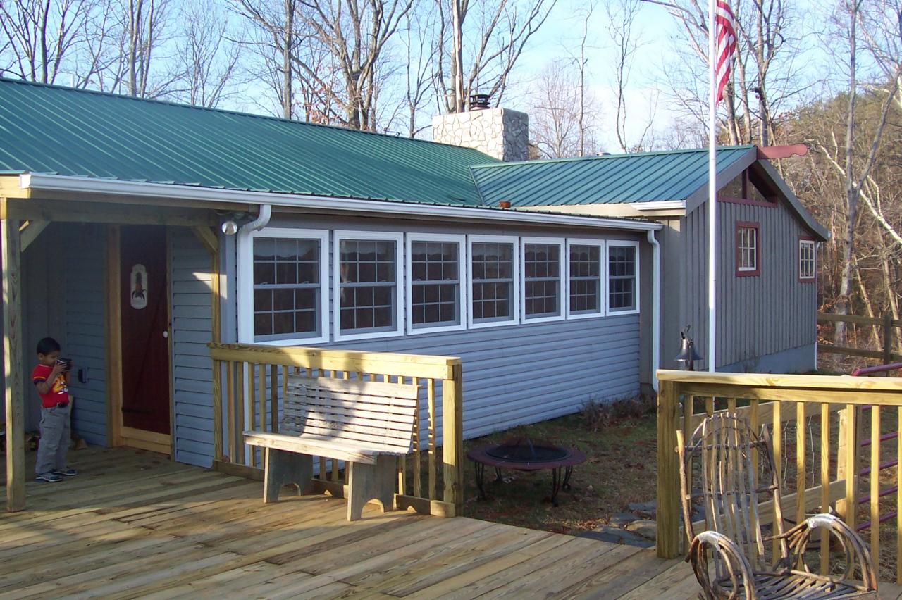 8266 Goodview Road Goodview, VA 24095 - Photo 14 of 23 a view of house with backyard and wooden fence
