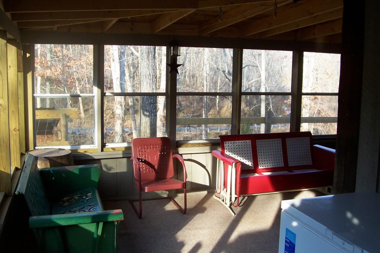 8266 Goodview Road Goodview, VA 24095 - Photo 3 of 23 a living room with furniture and a floor to ceiling window
