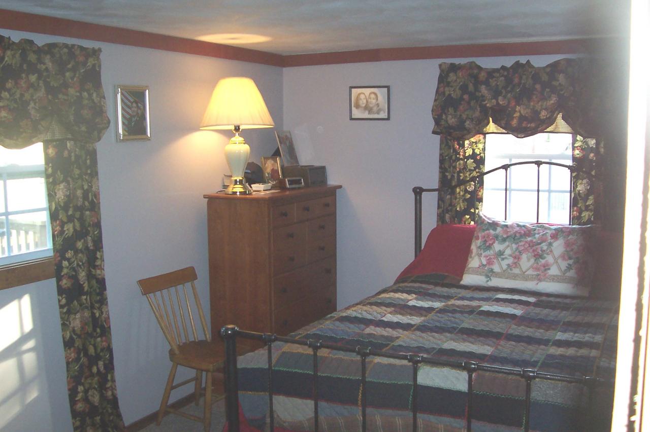8266 Goodview Road Goodview, VA 24095 - Photo 9 of 23 a bedroom with a bed and a window