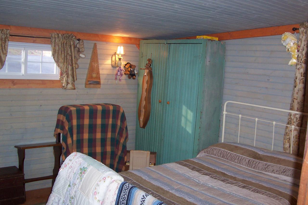 8266 Goodview Road Goodview, VA 24095 - Photo 10 of 23 a bedroom with a bed and wooden floor