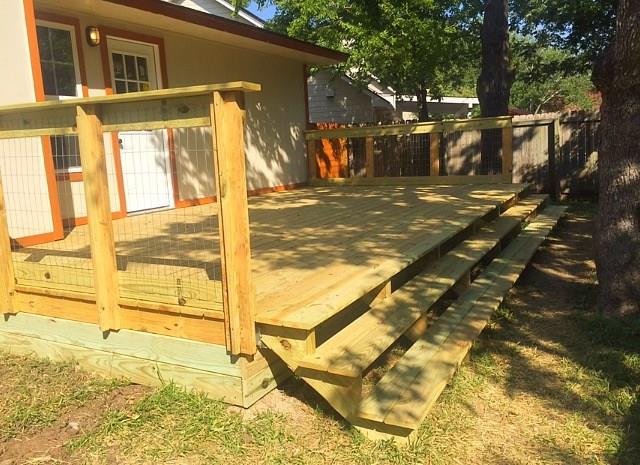 3305 Spaniel Drive Austin, TX 78759 - Photo 8 of 20 A spacious wooden deck with ample room for outdoor enjoyment and direct access to the yard.