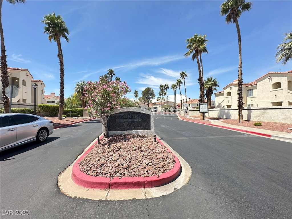 698 South Racetrack Road, Unit 322 Henderson, NV 89015 - Photo 1 of 39 View of road featuring a residential view, sidewalks, and curbs