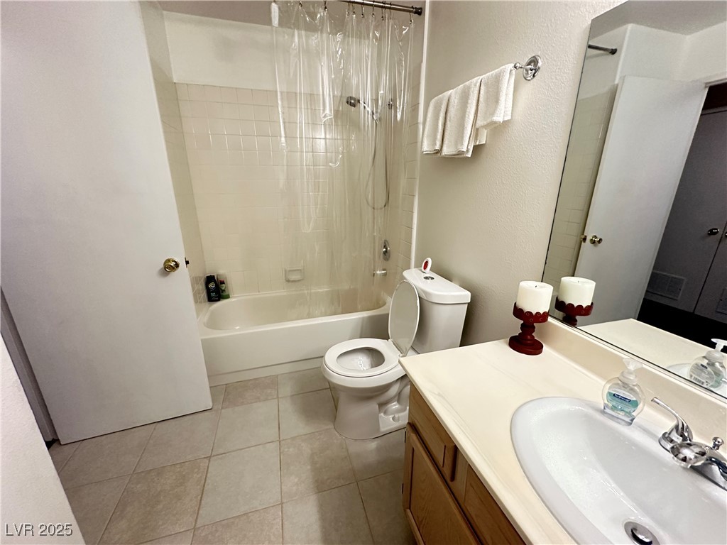 698 South Racetrack Road, Unit 322 Henderson, NV 89015 - Photo 28 of 39 Bathroom with vanity, tile patterned flooring, toilet, and shower / tub combo