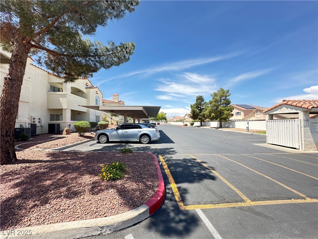 698 South Racetrack Road, Unit 322 Henderson, NV 89015 - Photo 37 of 39 View of road featuring a residential view and curbs