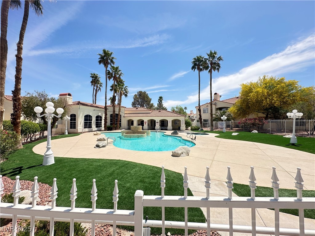 698 South Racetrack Road, Unit 322 Henderson, NV 89015 - Photo 39 of 39 Community pool featuring a lawn, fence, and a patio