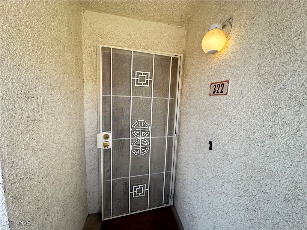 698 South Racetrack Road, Unit 322 Henderson, NV 89015 - Photo 4 of 39 Property entrance with stucco siding