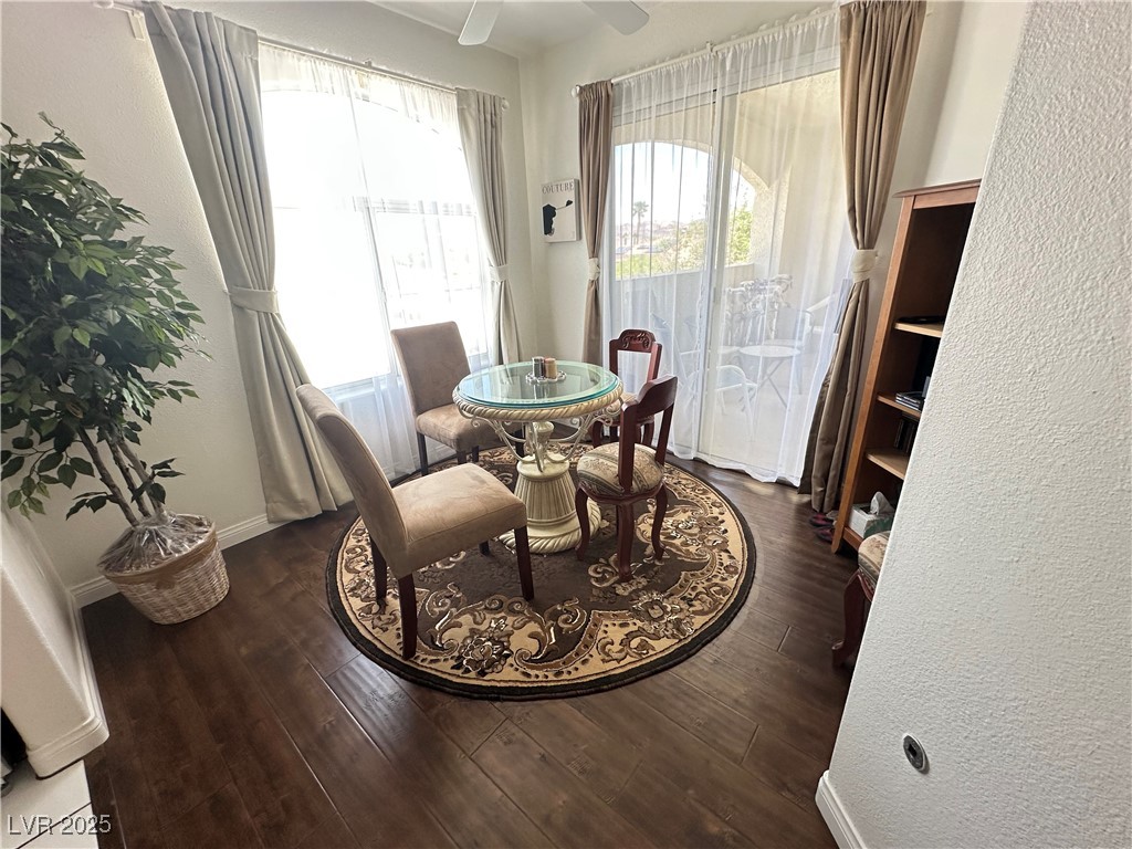 698 South Racetrack Road, Unit 322 Henderson, NV 89015 - Photo 8 of 39 Dining area featuring baseboards, a ceiling fan, a textured wall, and wood finished floors