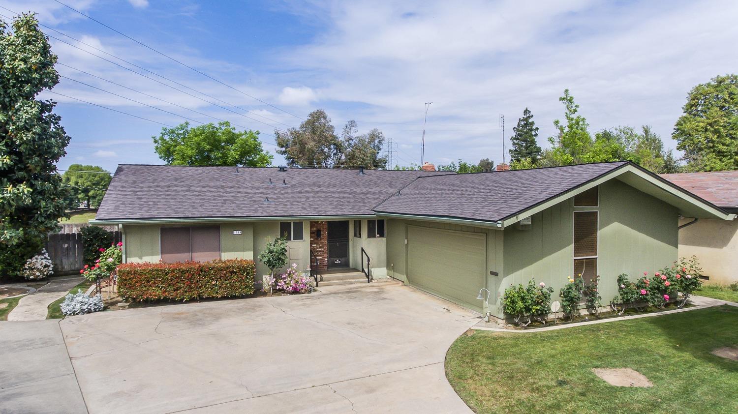 1729 North Recreation Avenue Fresno, CA 93703 - Photo 1 of 30 a house view with a garden space