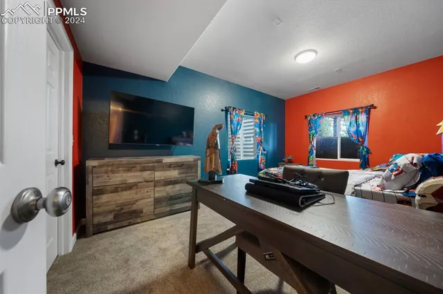 a room with furniture and a flat screen tv