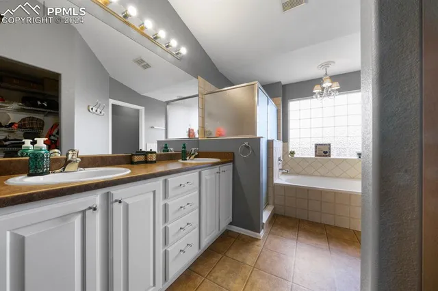 a bathroom with a sink a mirror and a bathtub